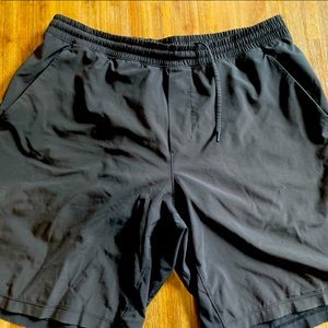 Black lululemon license to train shorts with liner.  XL